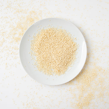 A photo of Organic White Hulled Sesame Seeds when served on white plate - Naked Foods