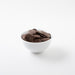 Milk Carob Buttons (Carob) in white bowl - Naked Foods