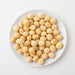 Raw Macadamias (Raw Nuts) when served in white plate - Naked Foods