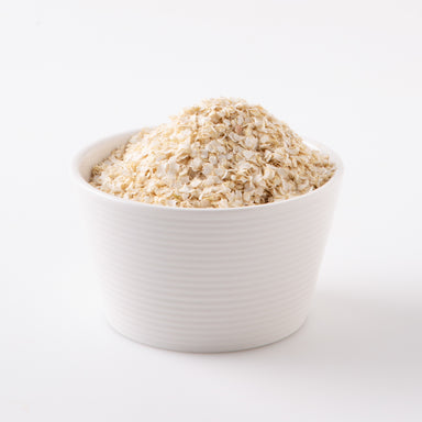 A bowl of Organic Rolled Flaked Quinoa (Cereals) - Naked Foods