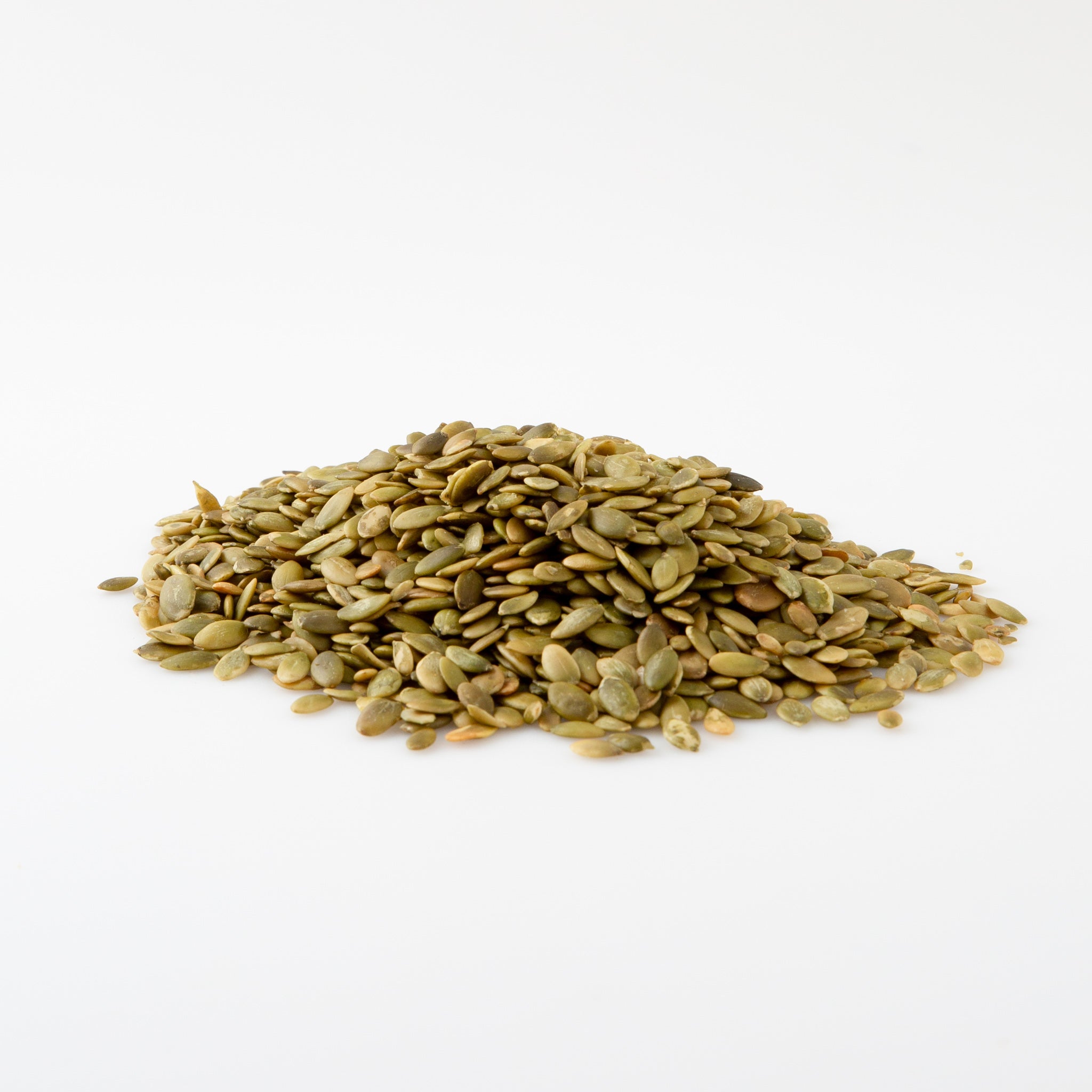 A heap of Organic Pepitas (Seeds) in white background - Naked Foods