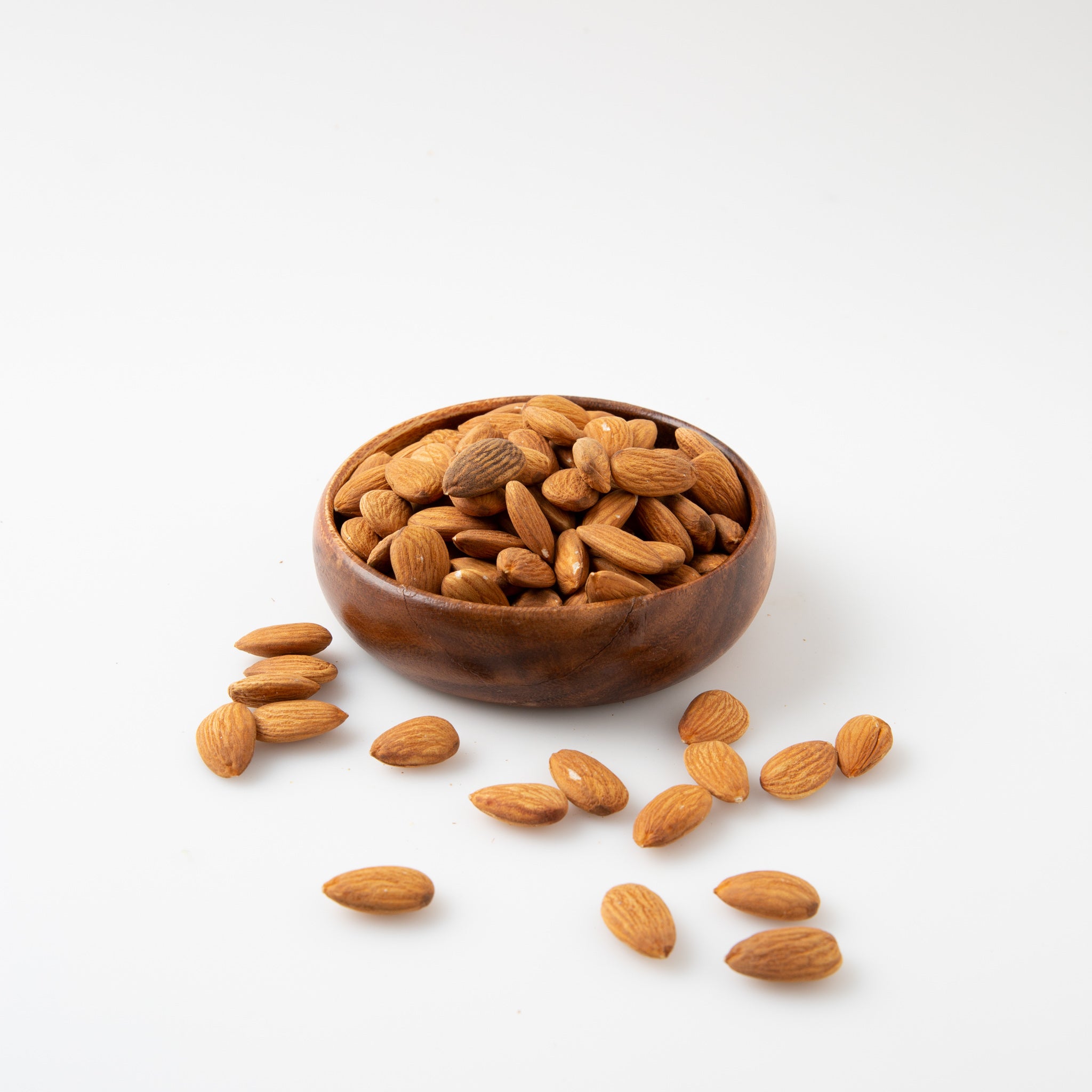 Pesticide Free Almonds (Raw Nuts) in small wooden bowl - Naked Foods