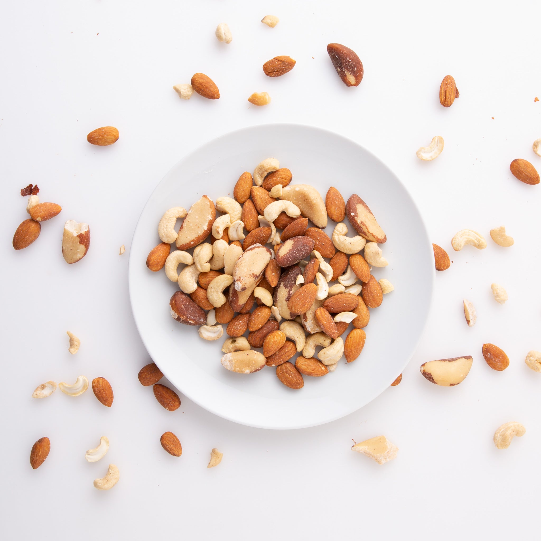 Organic ABC Mix Nuts (Raw Nuts) on small white plate - Naked Foods