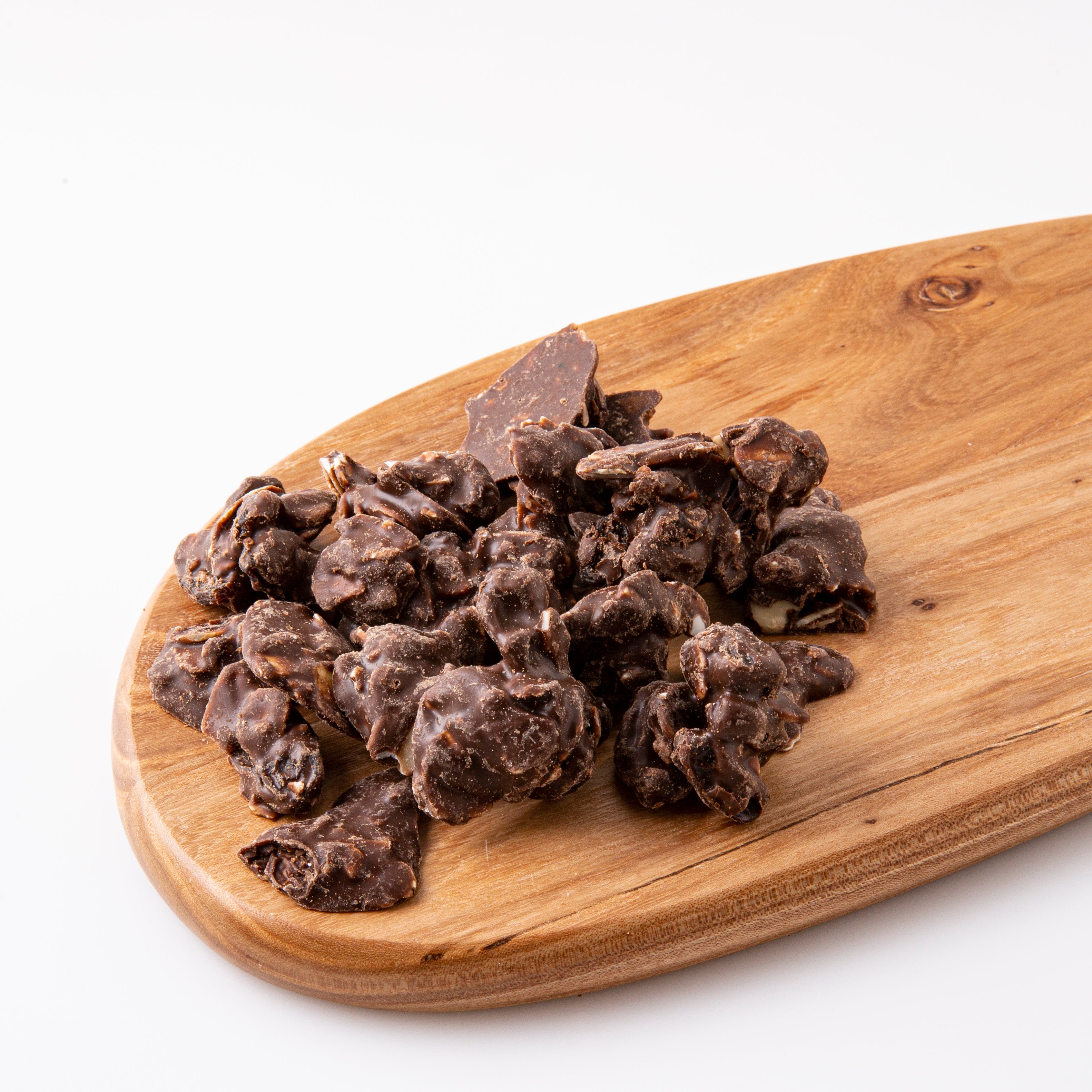 Almond and Raisin Carob Clusters on Wooden Serving Board - Naked Foods