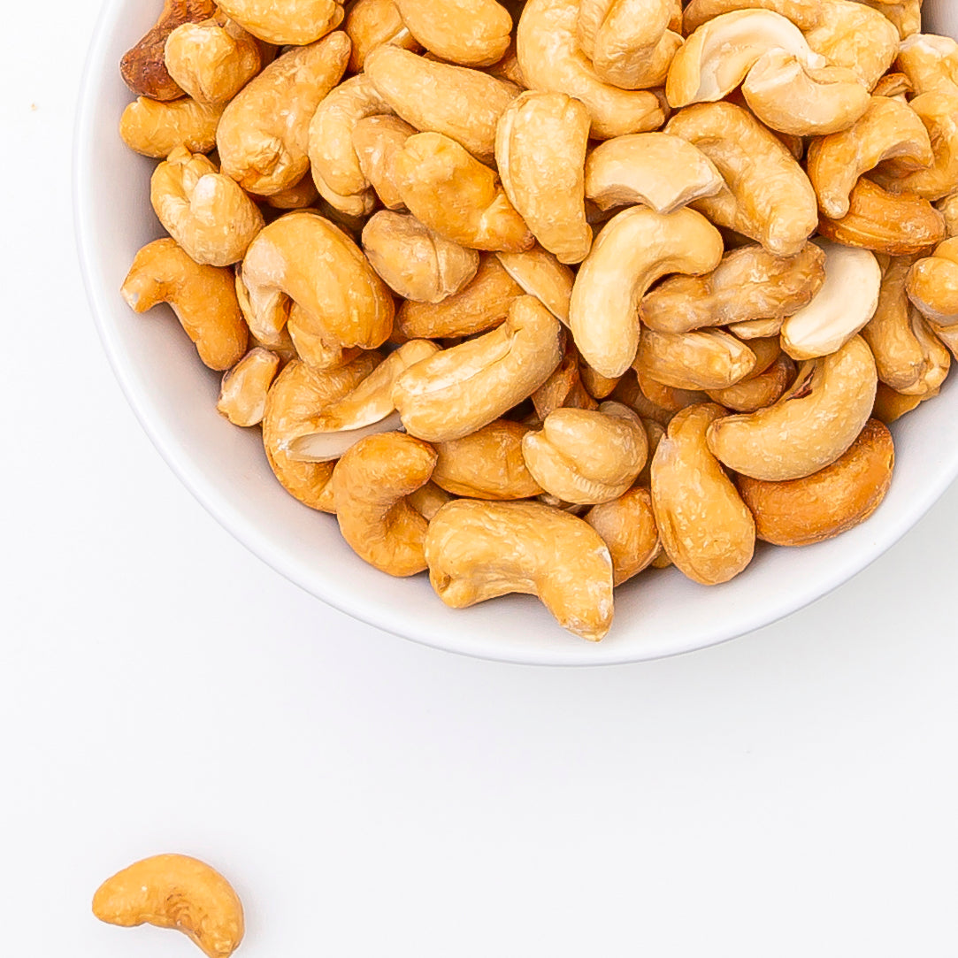 Roasted Salted Cashews (Roasted Nuts) served in white bowl - Naked Foods