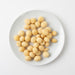 Roasted Unsalted Macadamias (Roasted Nuts) when served in white plate- Naked Foods