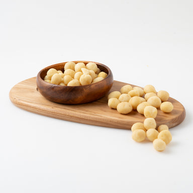 Roasted Unsalted Macadamias (Roasted Nuts) in serving board and bowl - Naked Foods