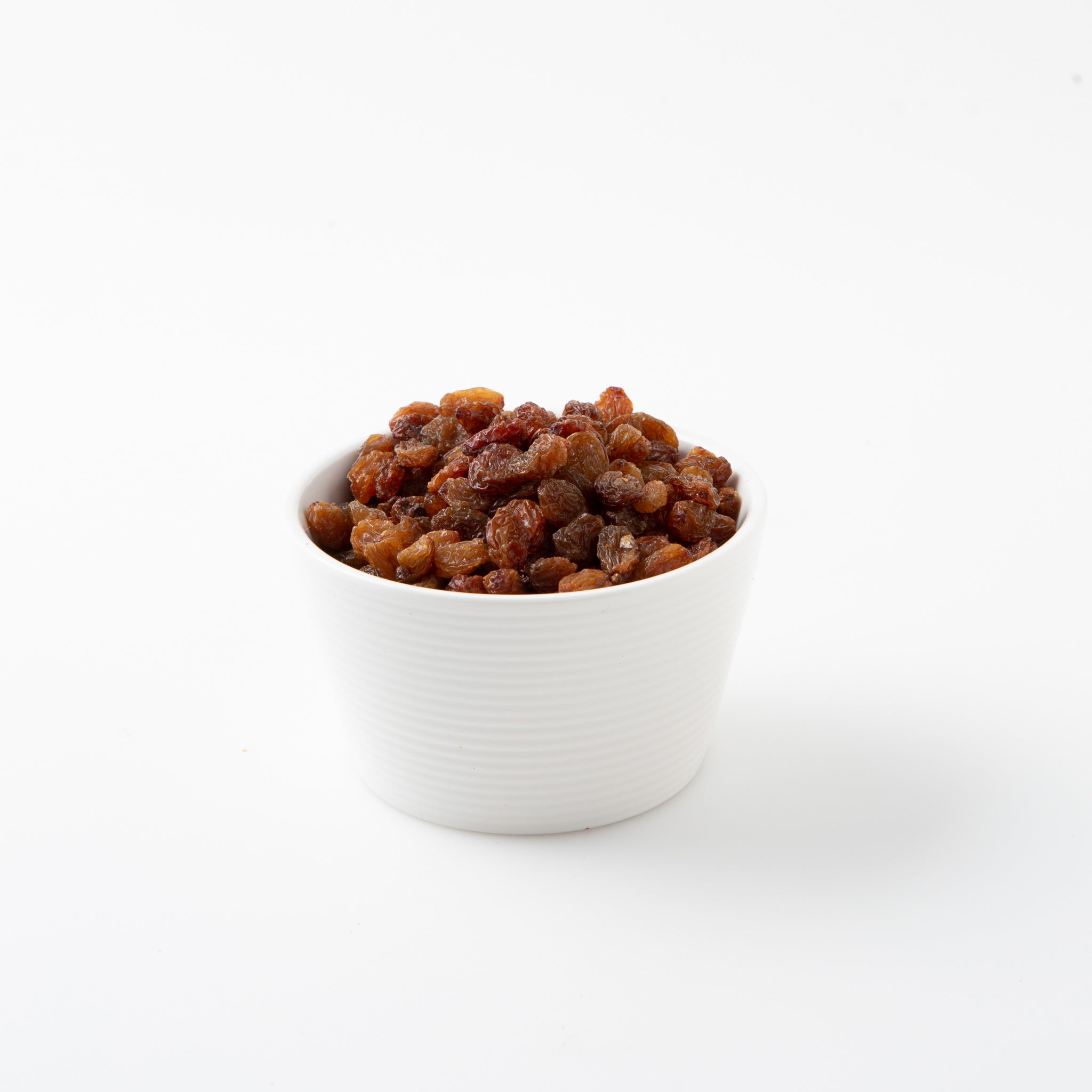 Organic Dried Sultanas (Dried Fruits) in small white bowl - Naked Foods