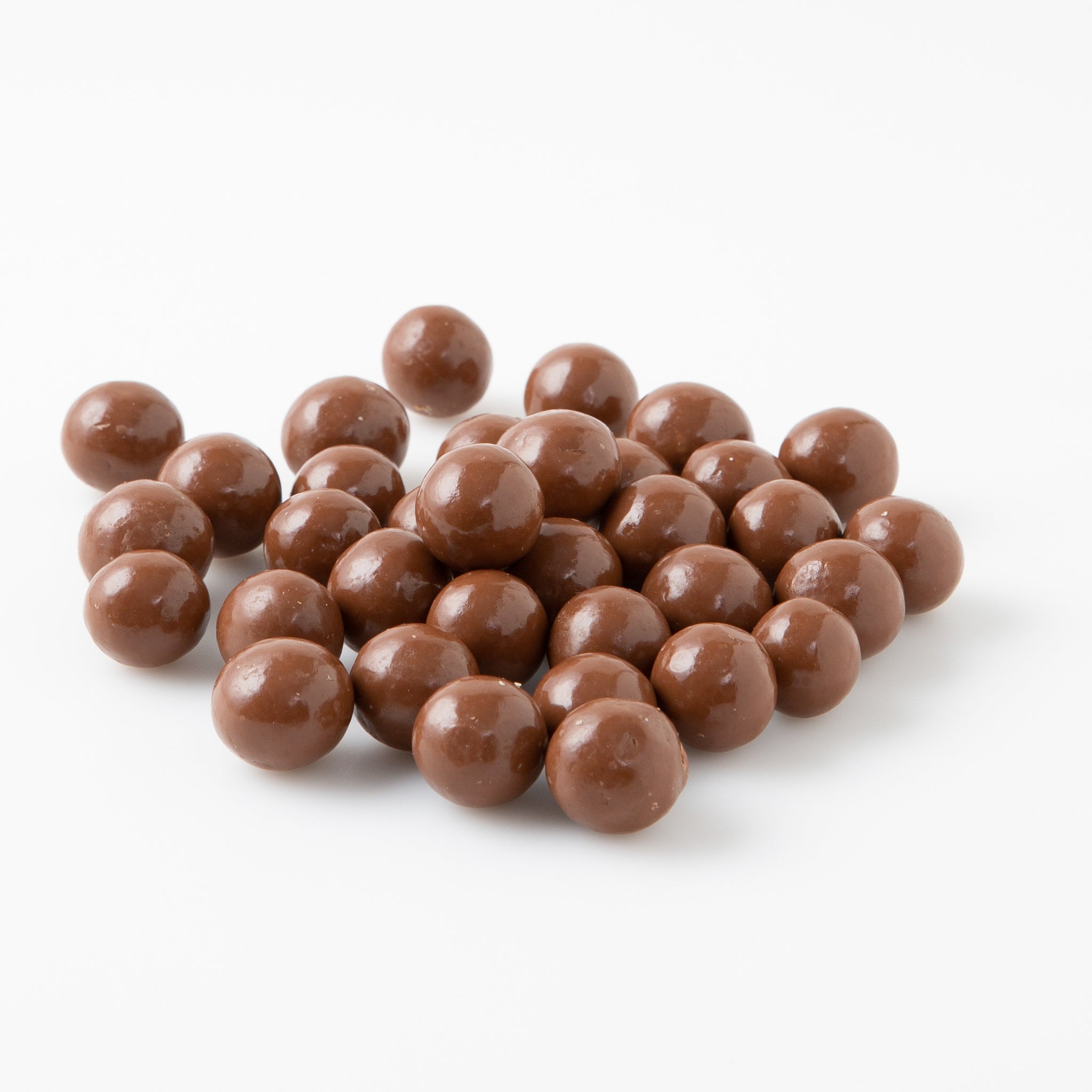 A pile of Milk Chocolate Hazelnuts (Chocolates) - Naked Foods