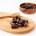 Dark Chocolate Licorice Bullets (Chocolates) when served in bowl and serving board - Naked Foods