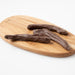 Carob Coated Bananas (Carob) on wooden serving board - Naked Foods