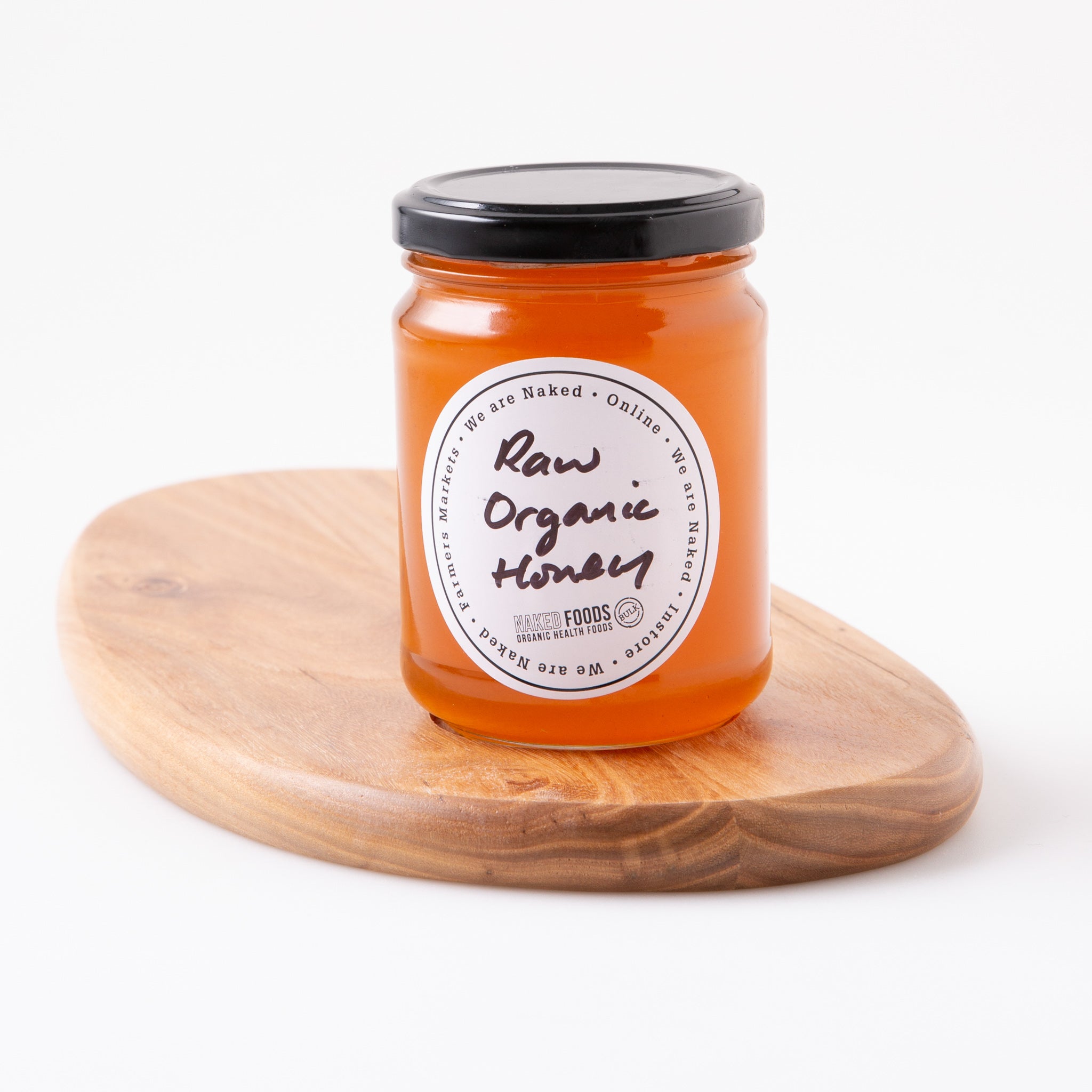 A jar of raw organic honey made in Australia by Naked Foods