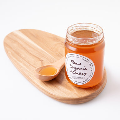 Raw Organic Honey in Wooden Serving Spoon- Naked Foods
